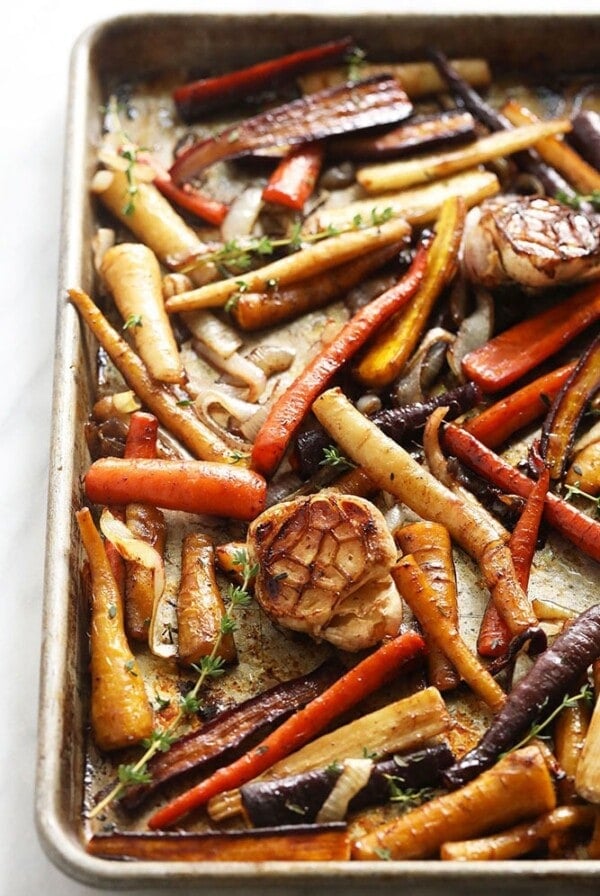 roasted carrots and garlic on a baking tray