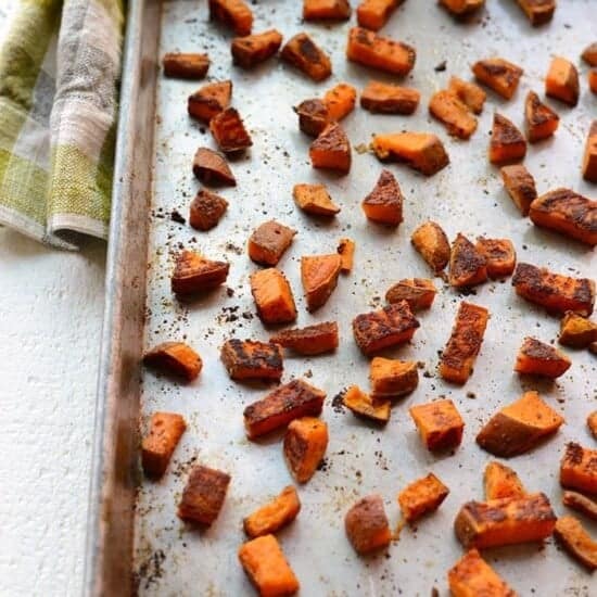 Roasted sweet potatoes on a baking sheet.