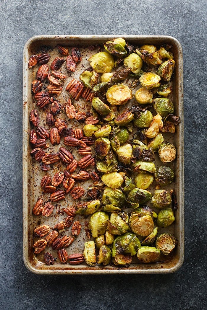 Brussel sprouts and pecans baked and ready to eat on a baking sheet