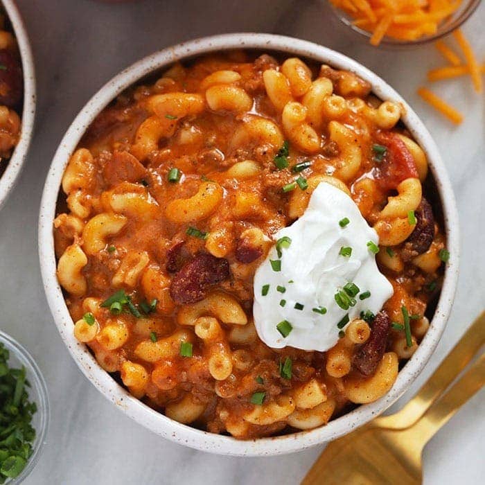 A scrumptious chili mac look    with sour cream.