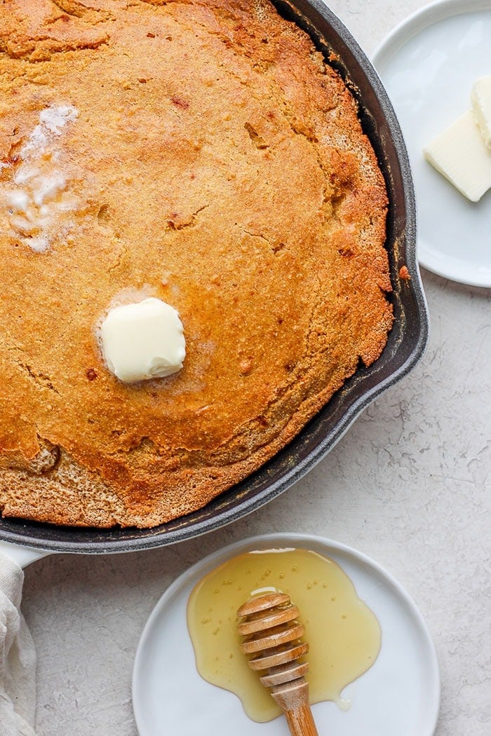 melted butter on cornbread in skillet