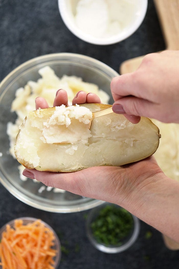removing the innards from a twice baked potato