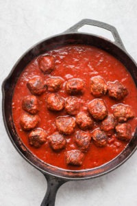 Meatballs and sauce in a pan.