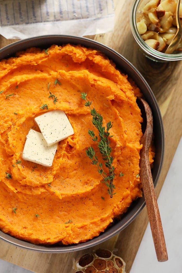 mashed sweet potatoes in bowl with butter
