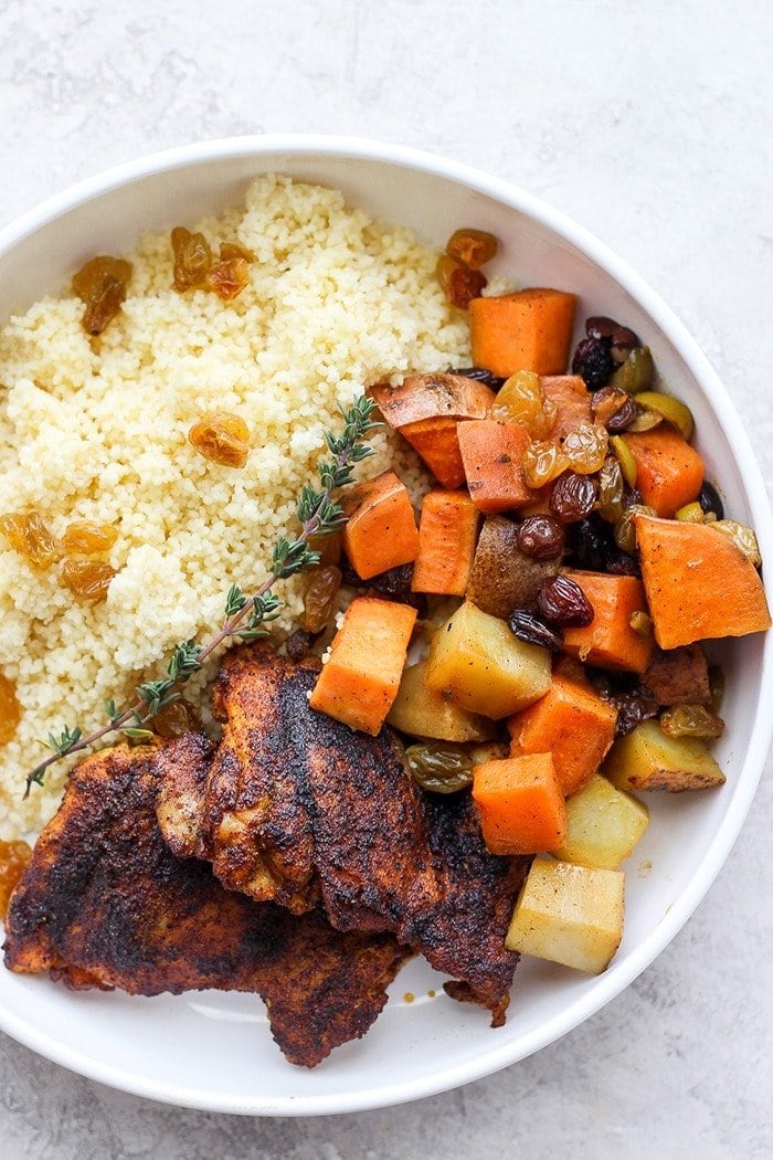 Plated moroccan chicken with couscous and vegetables