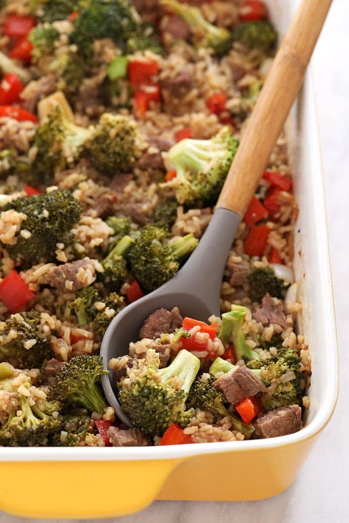 beef and broccoli with rice in dish