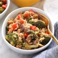 beef and broccoli with rice in dish