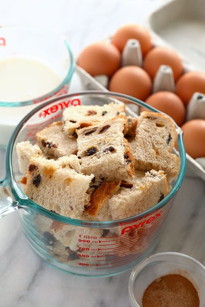 Cinnamon raisin bread in a measuring cup