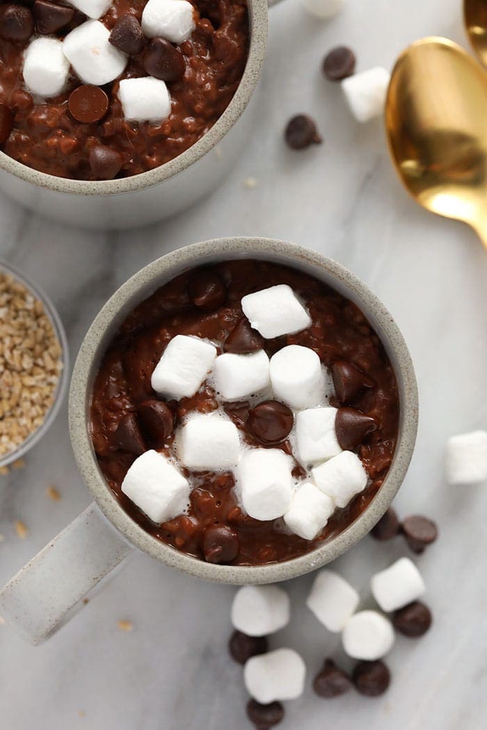،t cocoa steel cut oats in a mug topped with mallows