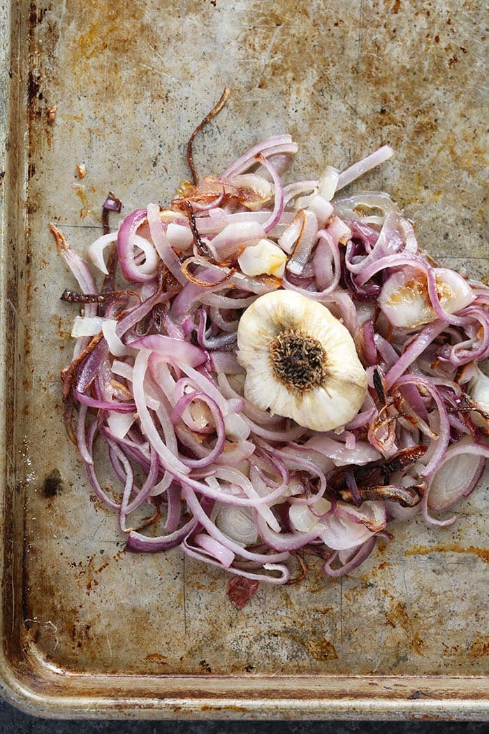 Roasted onions on a baking sheet 