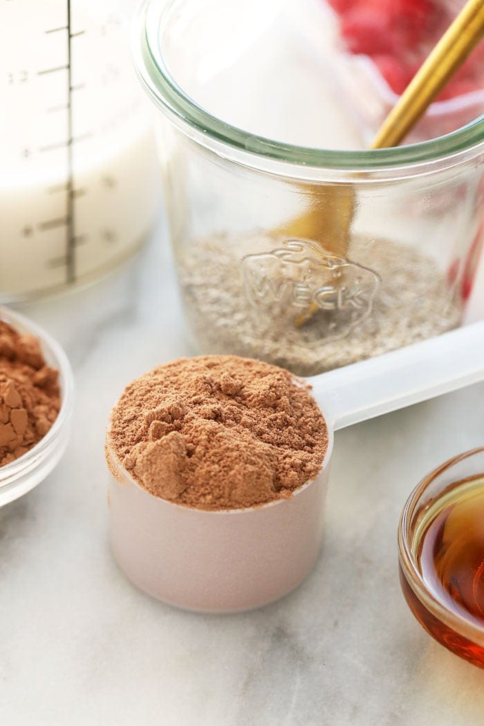 Chocolate protein powder in a scoop