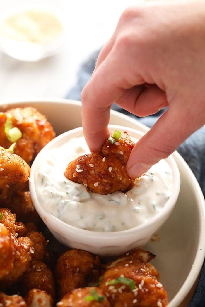 Dipping a cauliflower wing in dip