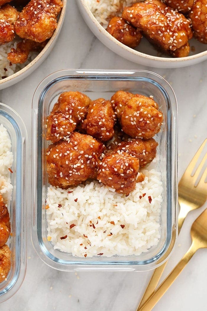 General Tsos Cauliflower in a meal prep container 