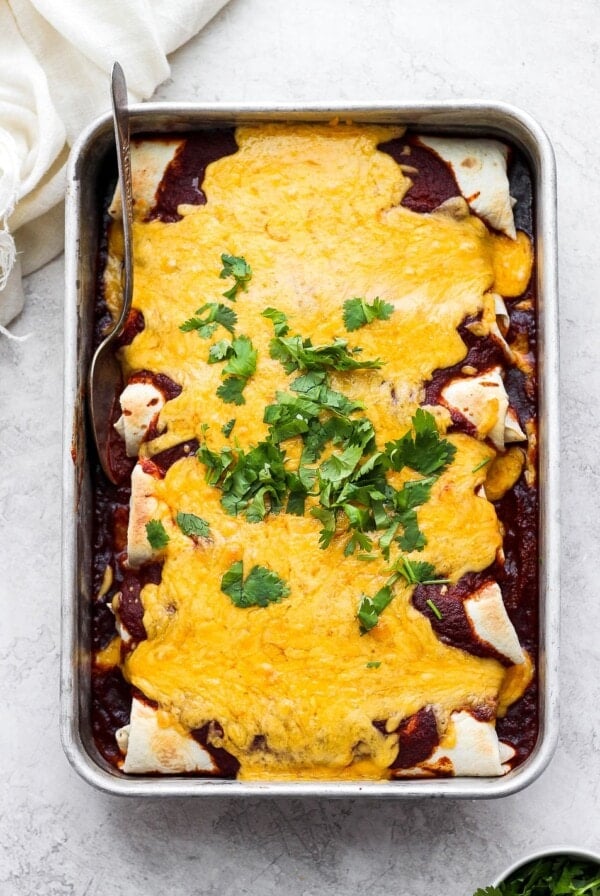 pan of enchilada with cheese on top