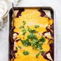 pan of enchiladas with cheese on top