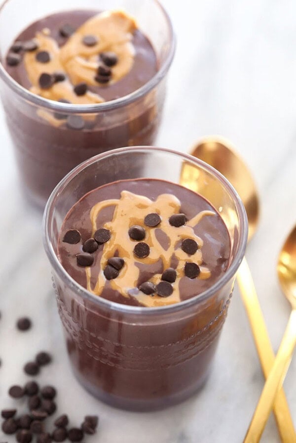 A chocolate protein shake made with chocolate pudding and peanut butter.