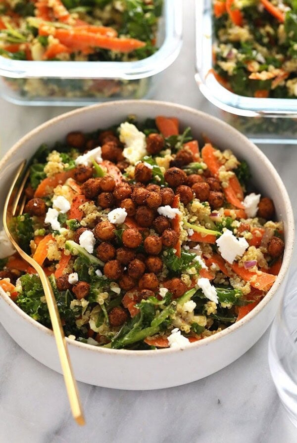 A healthy dish made from quinoa and vegetables, such as carrots and chickpeas.