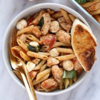 healthy caprese chicken pasta in a bowl