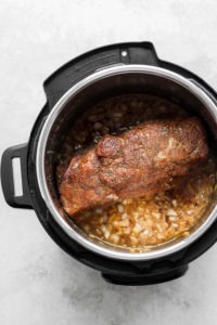 An Instant Pot filled with pulled pork.