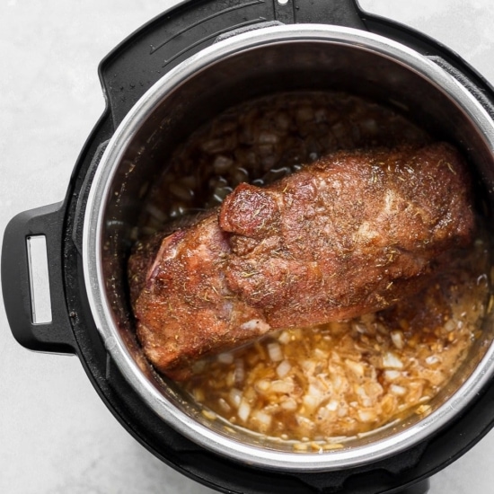 An Instant Pot filled with pulled pork.