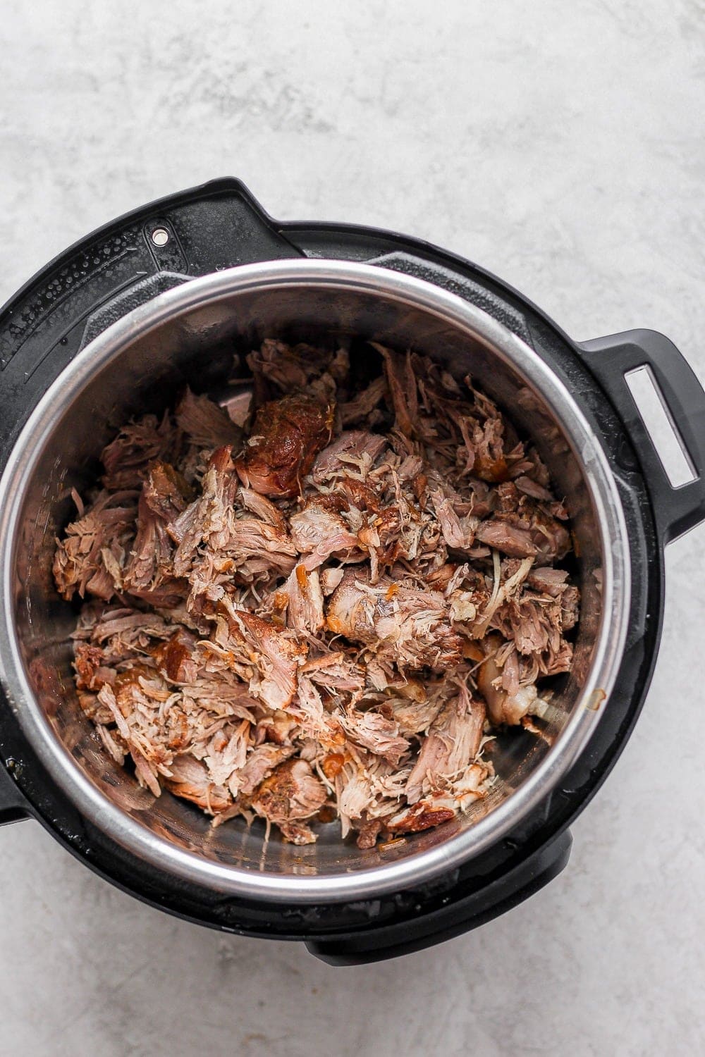 cooked shredded pulled pork in instant pot.