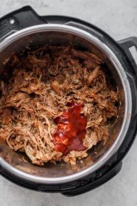 bbq sauce on pulled pork in Instant Pot.