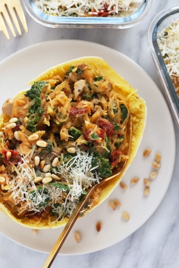 Instant Pot Spaghetti Squash stuffed with spinach and pine nuts.