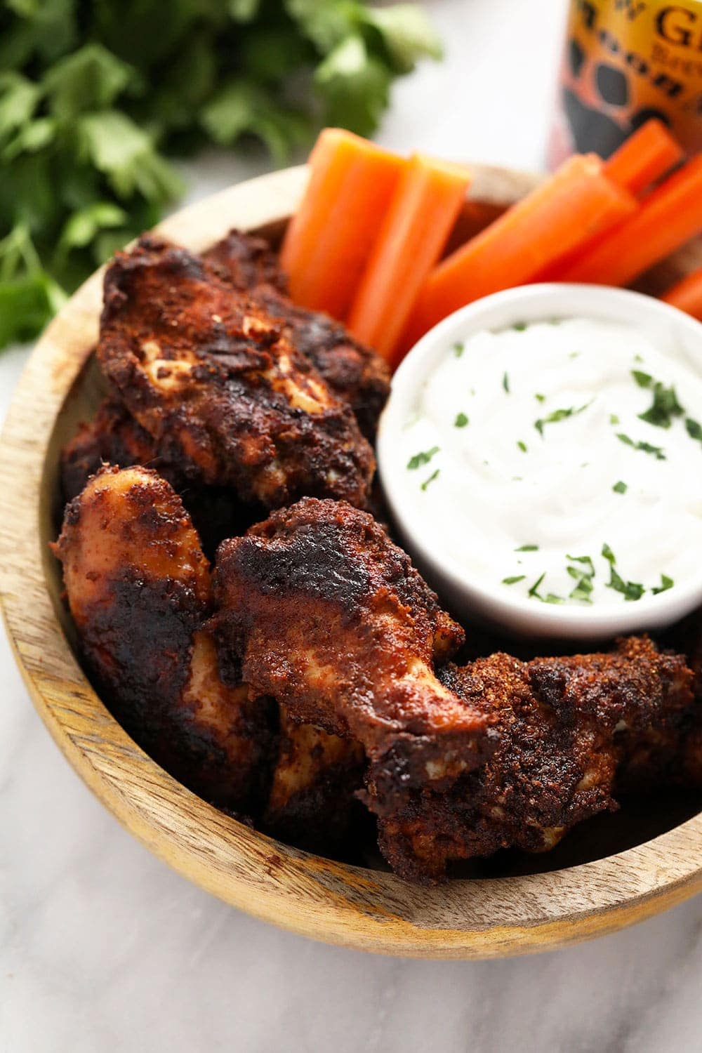 dry rub chicken wings with a blue cheese dip in a bowl