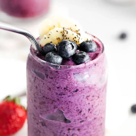 A triple berry smoothie with chia seeds and berries.