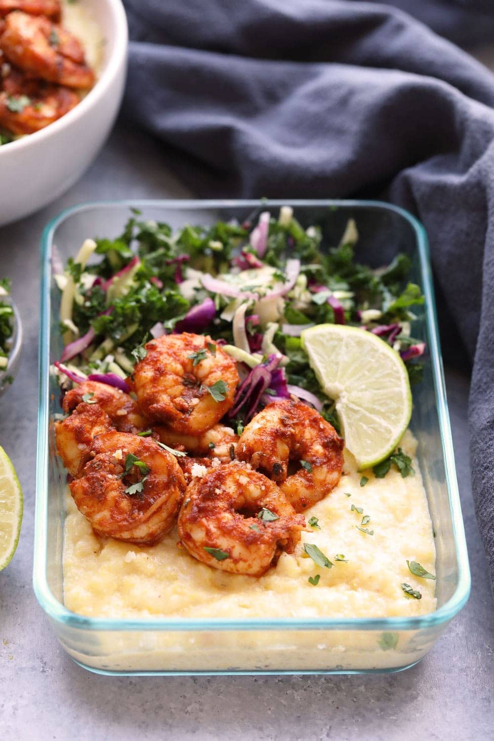 Cajun Shrimp and grits in a meal prep container