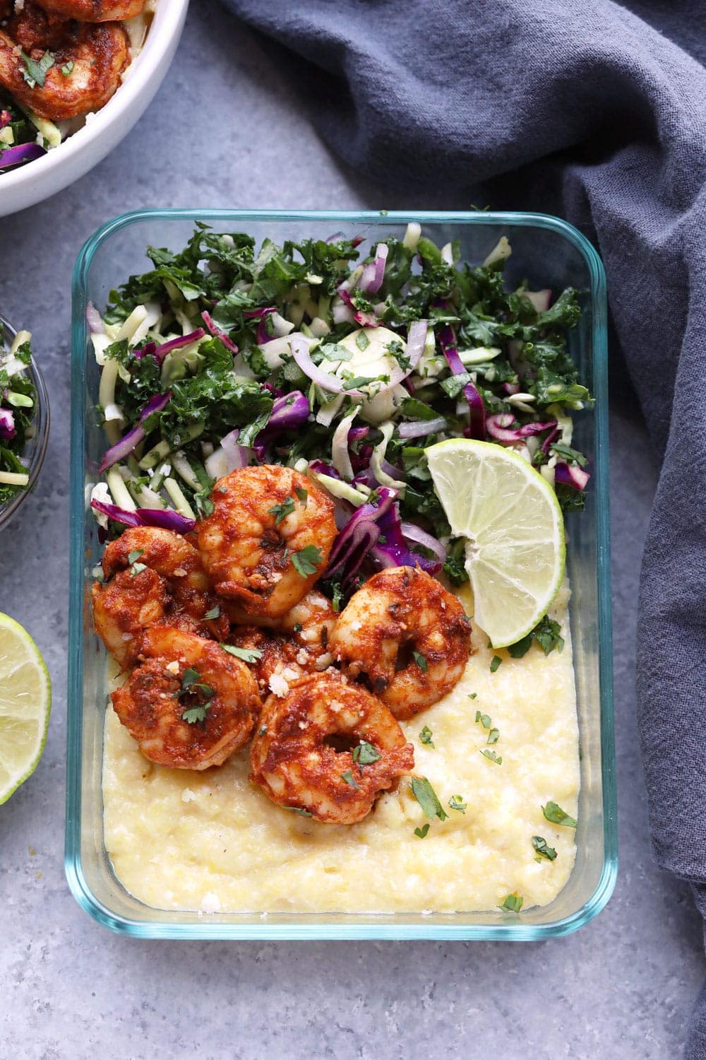 Cajun shrimp and grits in a meal prep container