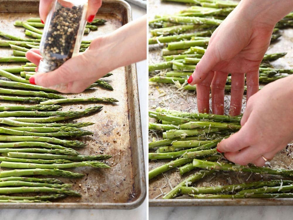 Salt and peppering asparagus on a baking sheet. 