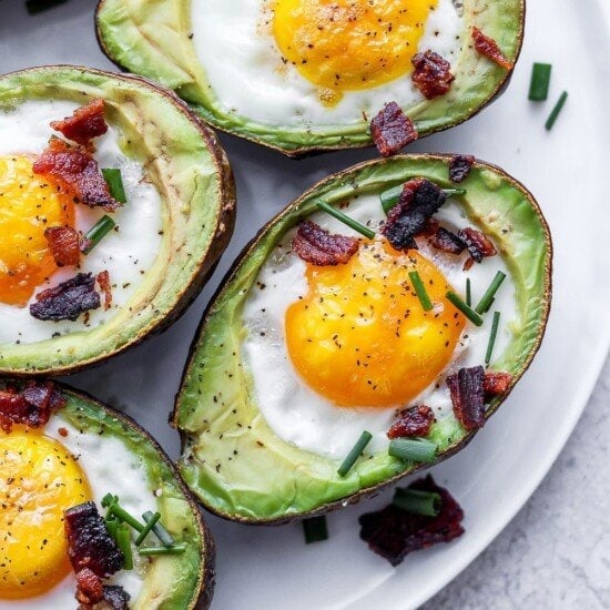 Avocado egg bake topped with bacon and chives