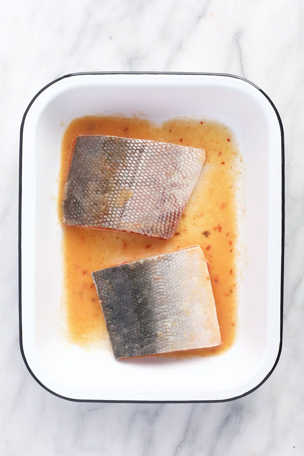 salmon marinading in pan