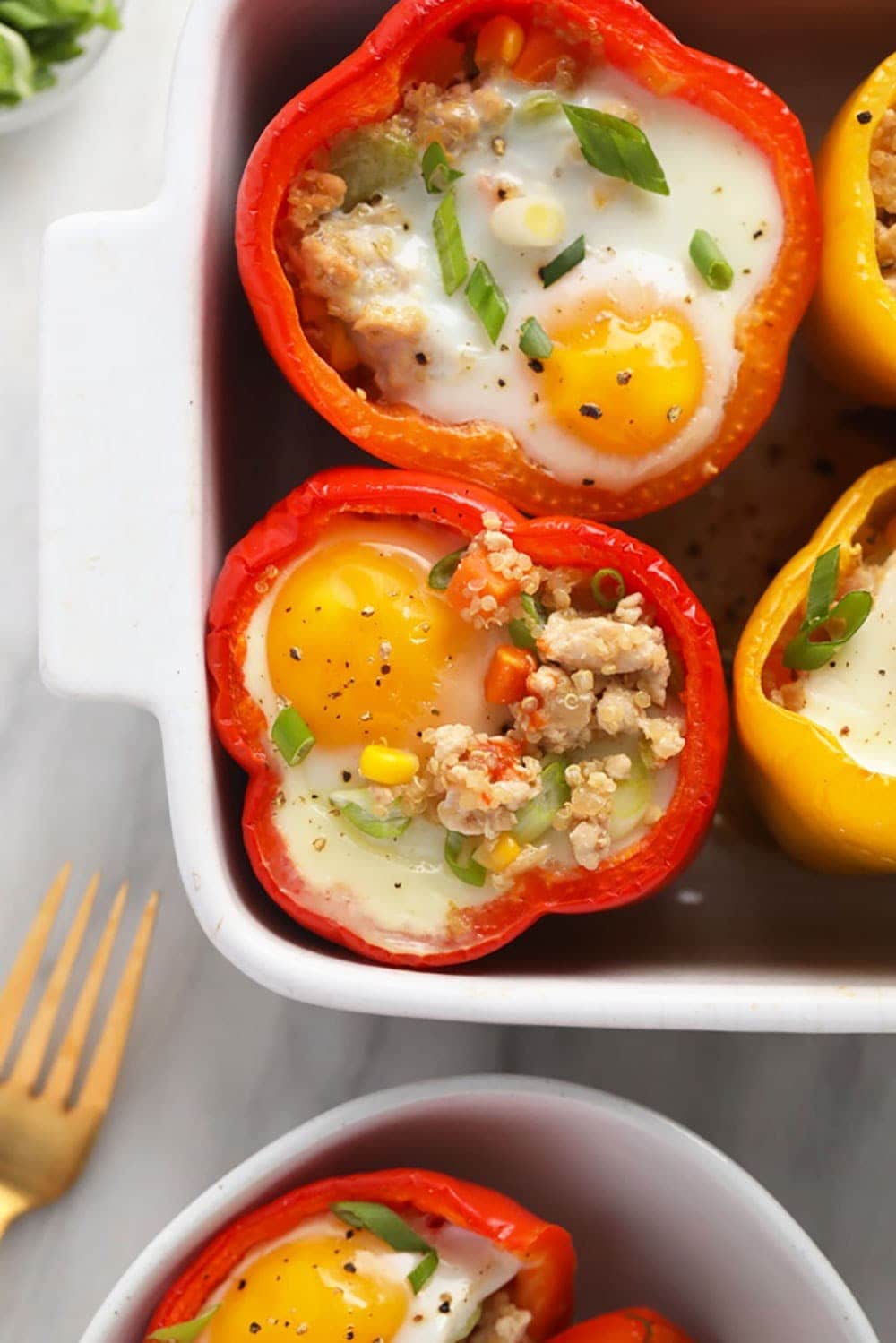stuffed peppers with eggs in a baking dish