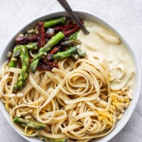 creamy vegan asparagus pasta on a plate