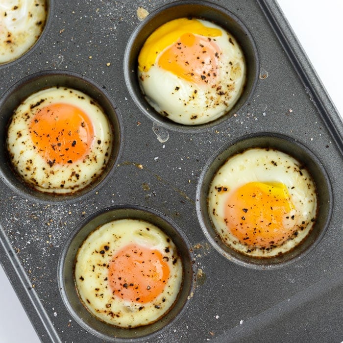 Eggs in a ،in tin displayed by Fit Foodie Finds on a white background.