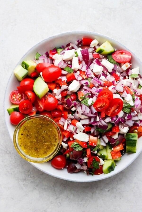Greek salad with tomatoes, cucumbers and onions.