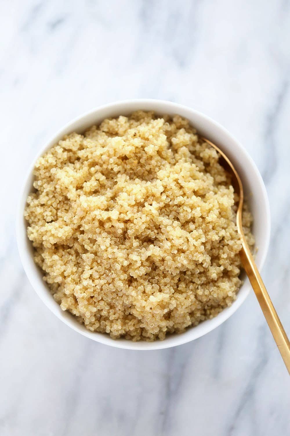 Learn a foolproof way to make perfectly fluffy quinoa every time with this stovetop quinoa recipe. All you need is quinoa and water and you're good to go! quinoa in bowl