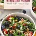 Delicious arugula salad with veggies.