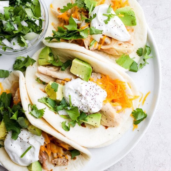 shredded chicken tacos on a plate