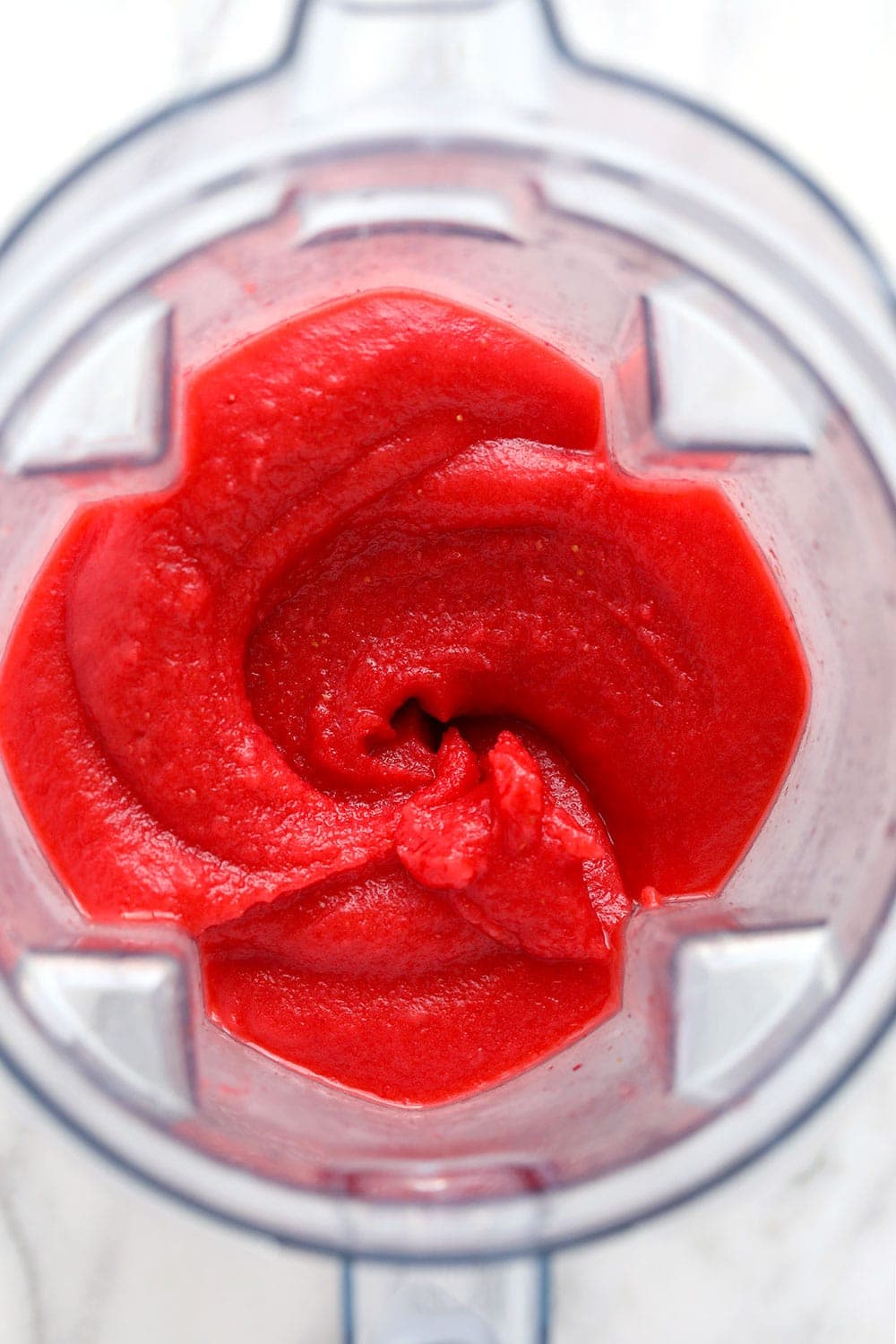 blended strawberry daiquiris in a blender