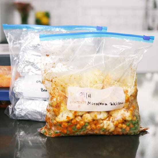 Two bags of vegetarian freezer meals are sitting on a counter.