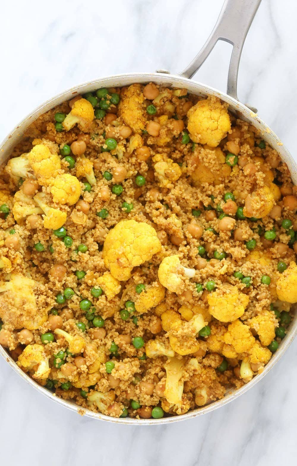 moroccan chickpea couscous in a skillet, ready to be served