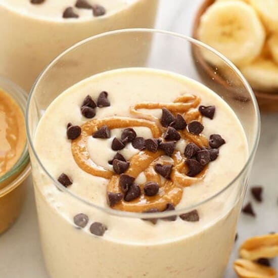 peanut butter banana smoothie in glass.