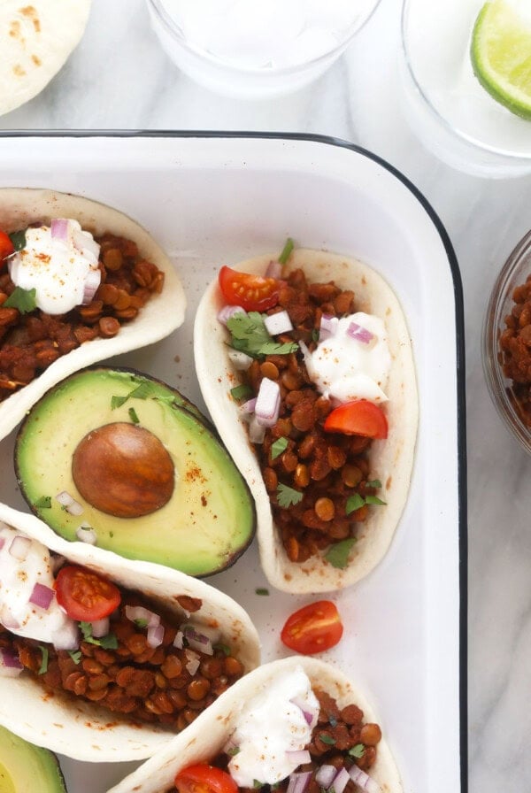 It only takes 5-ingredients to make this nutritious (and vegan!) Instant Pot Lentil Tacos recipe. Serve it on a tortilla, in a bowl or on nachos!