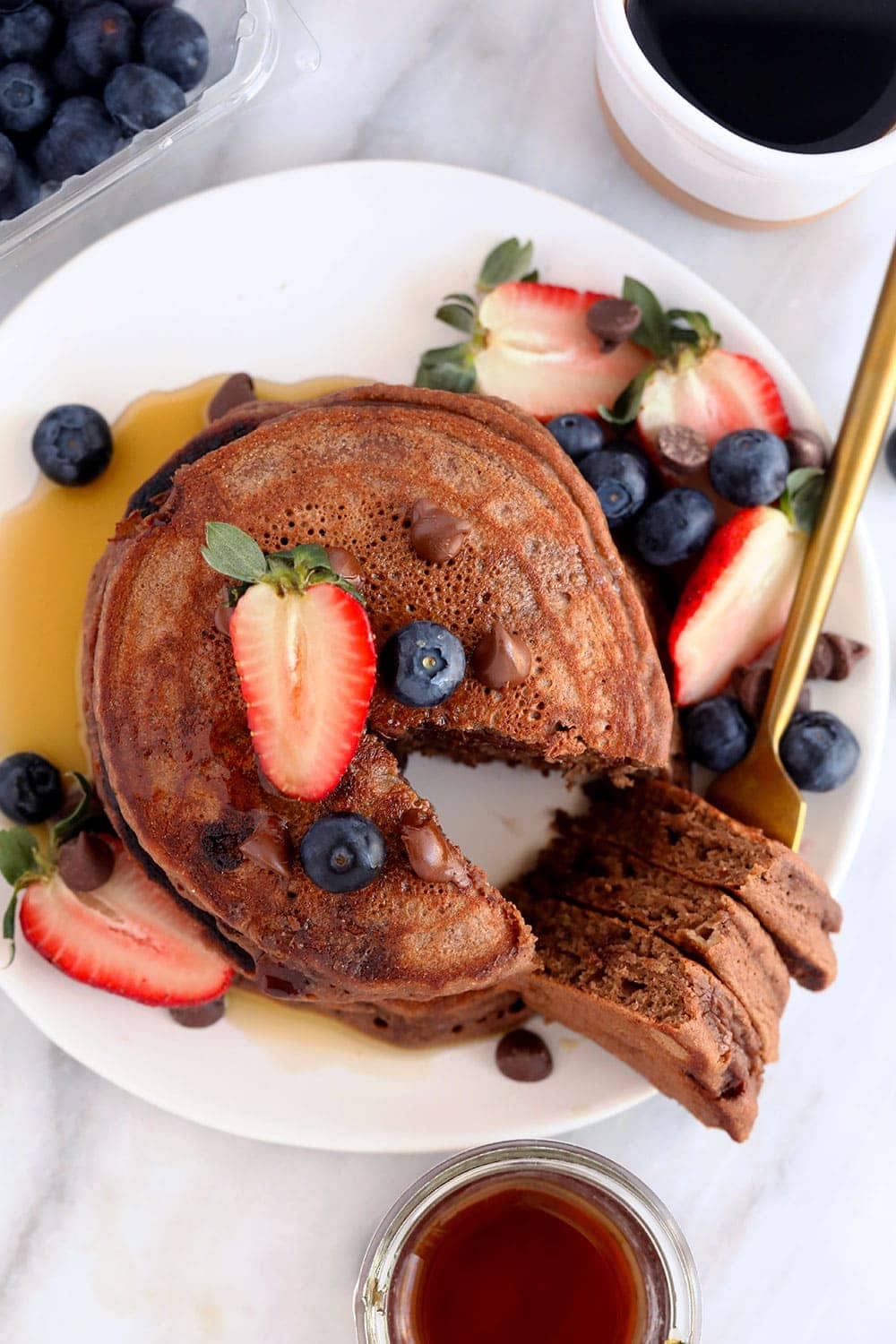 chocolate chocolate chip pancakes on a plate