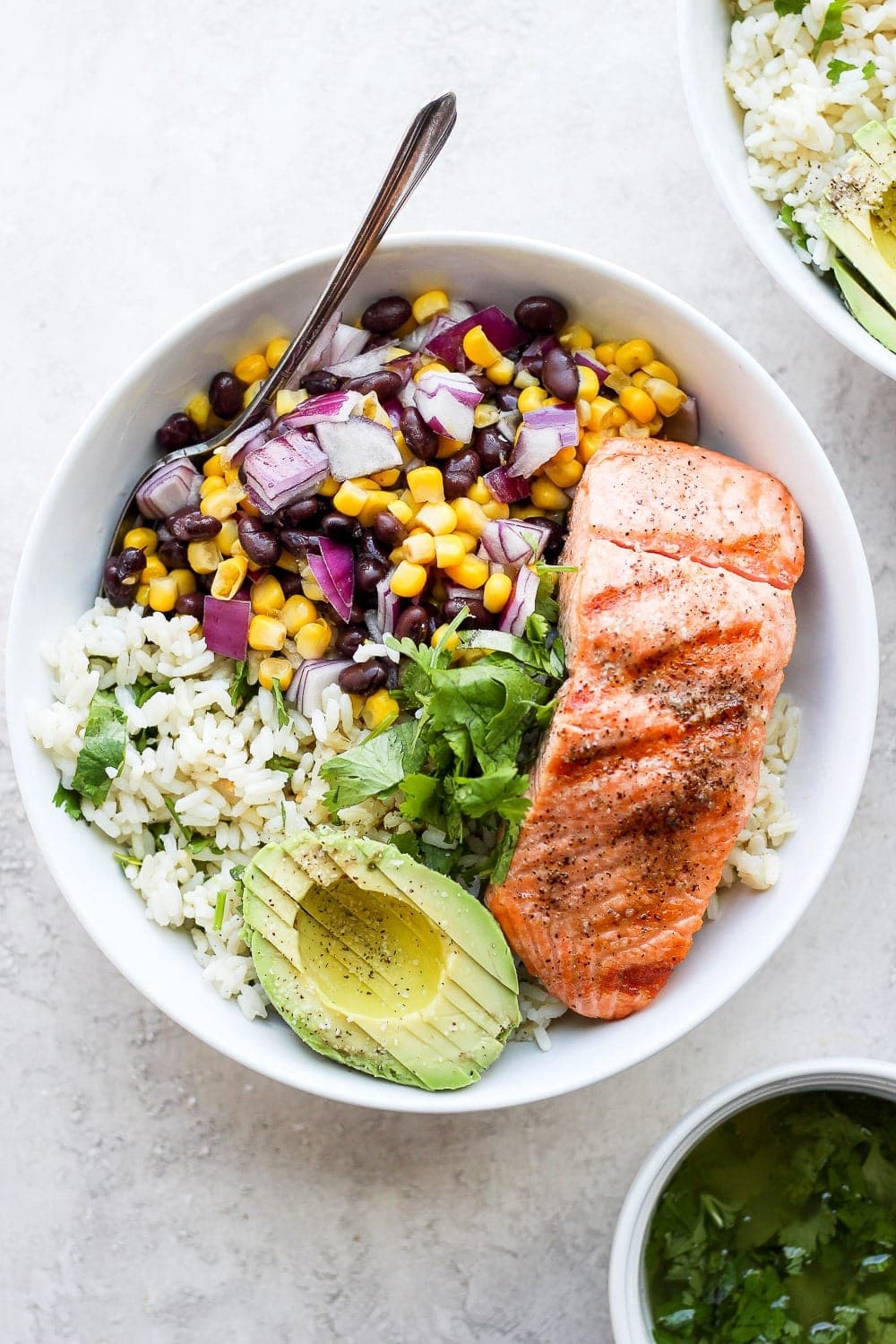 fiesta salmon rice bowls with cilantro lime rice and corn and bean salsa
