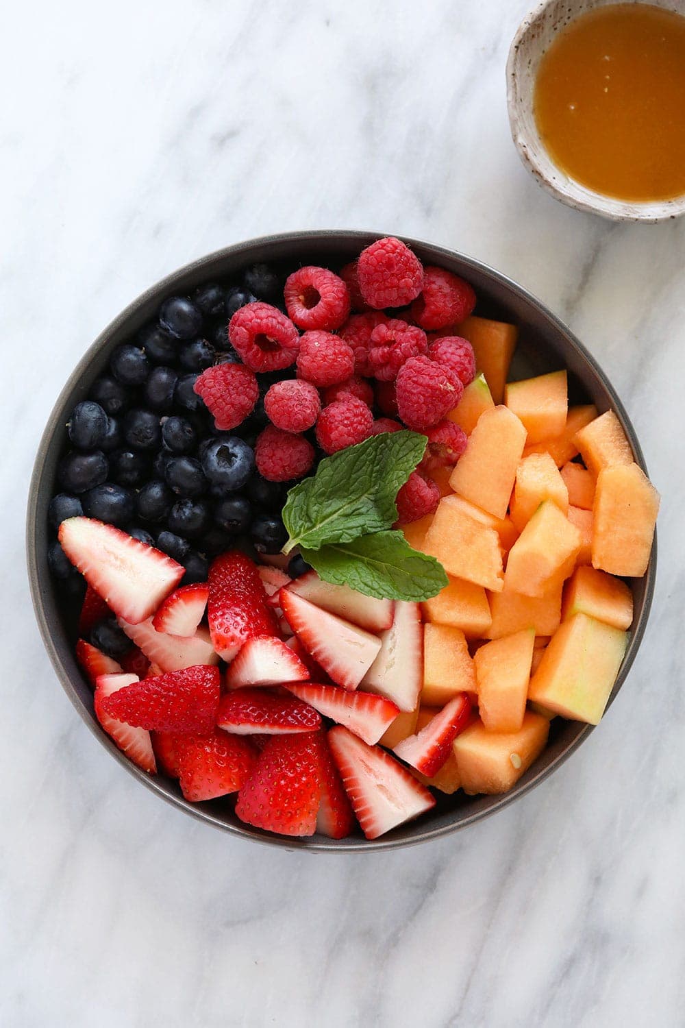 fresh fruit salad ingredients in a bowl