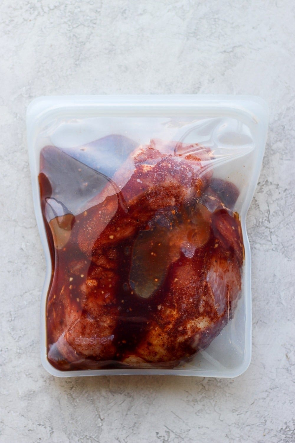 marinating pork in Stasher bag.